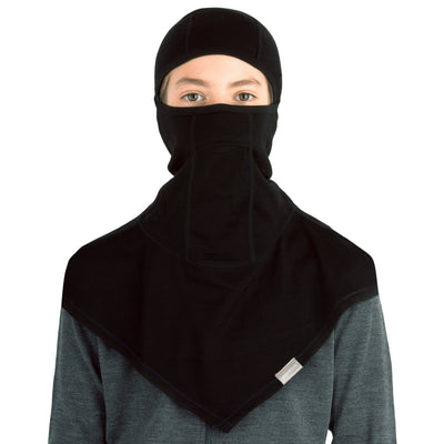 young adult wearing a black merino wool 200 youth balaclava face mask