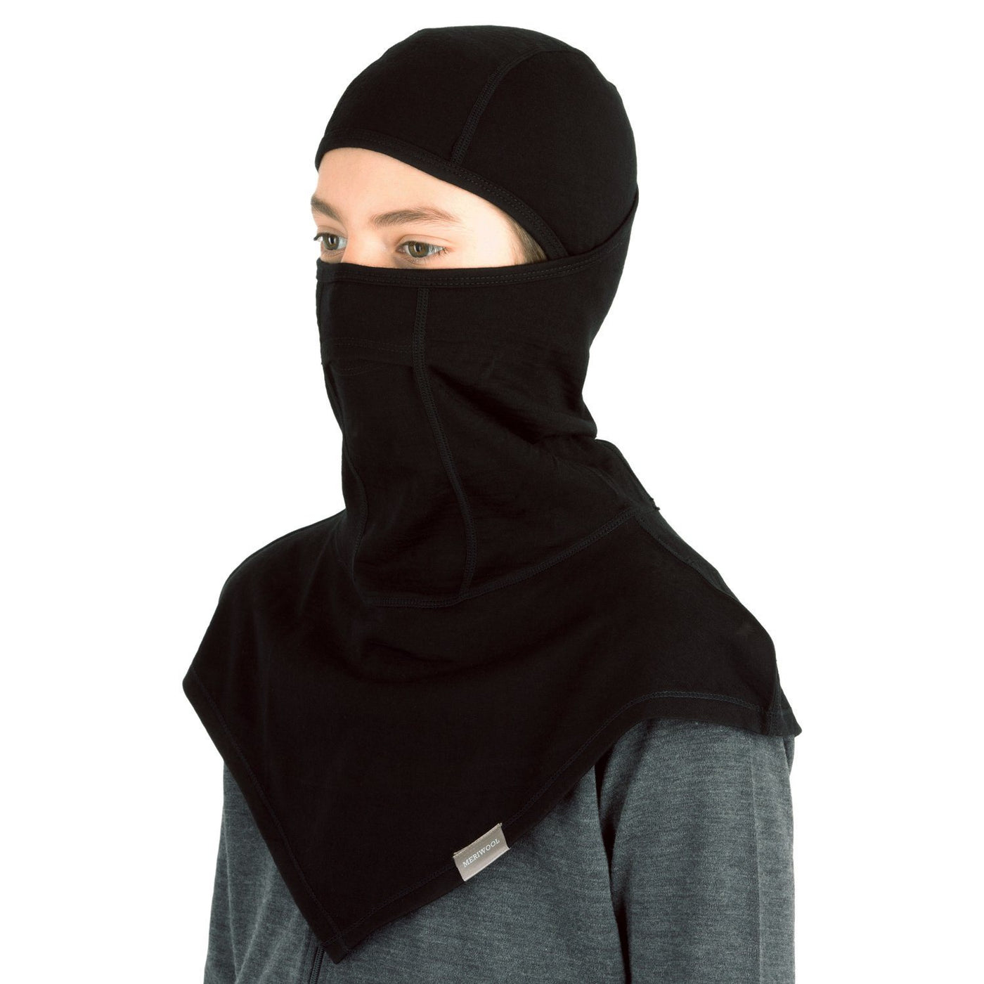 teenager wearing a black merino wool 200 youth balaclava face mask